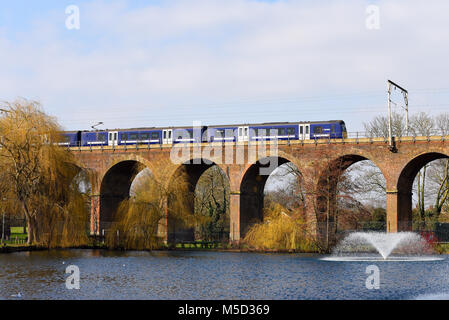 Greater Anglia Abellio British Rail Class 360 Desiro train crossing railway viaduct in Central Park, Chelmsford, Essex, line London Liverpool Street Stock Photo