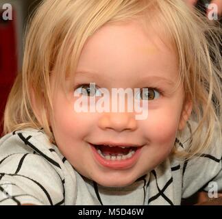 Portrait on a happy blond girl, Ystad, Sweden Stock Photo