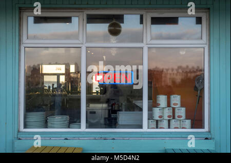 neon open sign in the window of a cafe, restaurant. Stock Photo