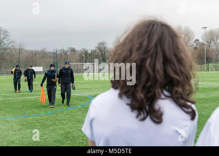 two young fans watch the sussex cricket team walk past on their wait to practice on the professional sports pitch Stock Photo