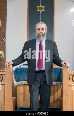 a rabbi stands in a synagogue for a portrait Stock Photo