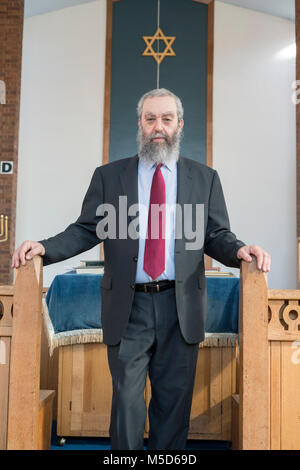 a rabbi stands in a synagogue for a portrait Stock Photo