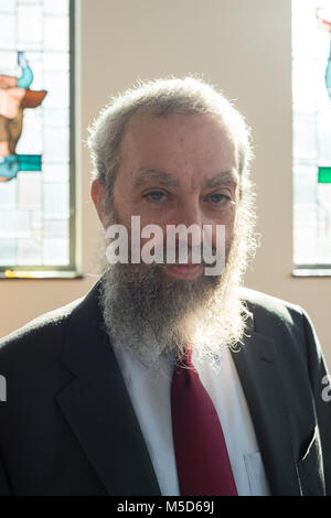 a rabbi stands in a synagogue for a portrait Stock Photo