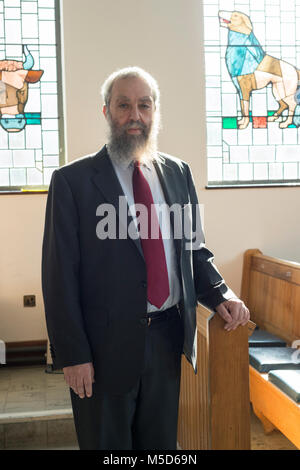 a rabbi stands in a synagogue for a portrait Stock Photo