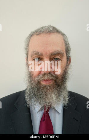 a rabbi stands in a synagogue for a portrait Stock Photo