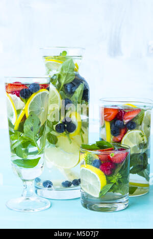Fresh infused water made with organic citruses ,basil ,strawberries and blueberries Stock Photo