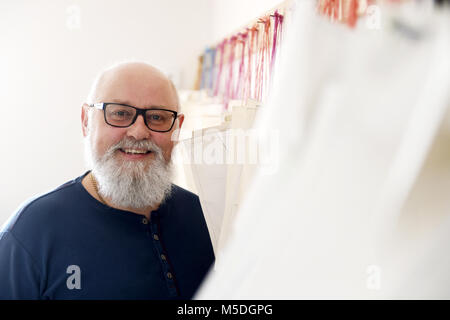 Businessman Ivo Tichy poses with materials for his brand products Don Quiet, Racing ski clothes and ski suits, in Neratov, Czech Republic, on February 22, 2018. Tichy's company Don Quiet dressed Czech athletes of the Czech Olympic Team for the 2018 Winter Olympics in Pyeongchang, South Korea. Czech alpine skier Ester Ledecka won the golden Olympic medal in a Don Quiet ski overall in Women's super-G Alpine skiing. (CTK Photo/Josef Vostarek) Stock Photo