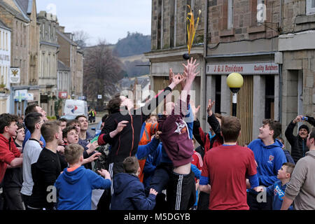 Jedburgh, Mercat Cross, UK. 22nd Feb, 2018. Jed Hand Ba' The annual game of hand ba' takes place every year the Thursday after Fastern's E'en. The tradition derives from 1548 when a party of Scots recaptured Ferniehirst Castle, a mile south of Jedburgh and used an Englishman's head in a celebratory game after the battle. ( Credit: Rob Gray/Alamy Live News Stock Photo