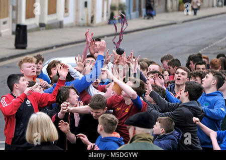 Jedburgh, Mercat Cross, UK. 22nd Feb, 2018. Jed Hand Ba' The annual game of hand ba' takes place every year the Thursday after Fastern's E'en. The tradition derives from 1548 when a party of Scots recaptured Ferniehirst Castle, a mile south of Jedburgh and used an Englishman's head in a celebratory game after the battle. ( Credit: Rob Gray/Alamy Live News Stock Photo