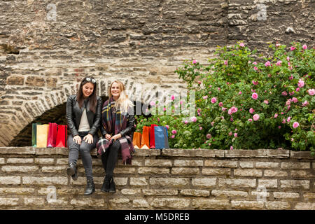 Two girl friends preparing for a vacation Stock Photo