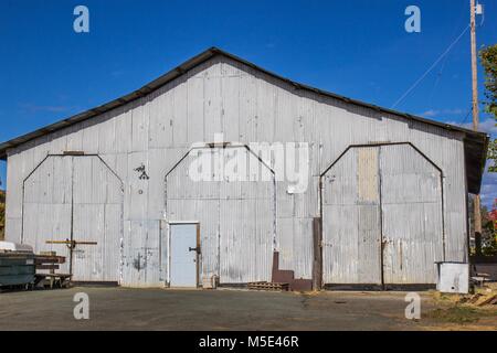 Corrugated Tin Building With High Doors Once Used For Railroad Maintenance Stock Photo