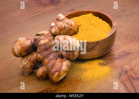 Turmeric (Curcuma longa) is a tropical plant in the same family as ginger, native to India, and cultivated throughout the tropics around the world. Th Stock Photo