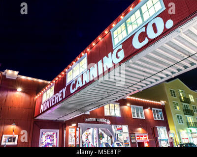 CANNERY ROW Monterey Canning Company building and shops tourist attraction lit up at night Cannery Row Monterey California USA Stock Photo