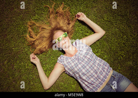 High angle view of fashionable woman relaxing in the field Stock Photo