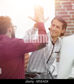 happy corporate couple giving each other a high five Stock Photo - Alamy