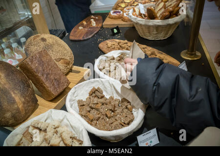 Customers reach for samples in the Great Northern Food Hall in Grand Central Terminal in New York on Thursday, June 8, 2017. (© Richard B. Levine) Stock Photo