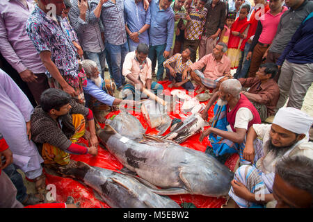 Visitors gathered to see 100- kg ' Baghar Fish' slicing. Stock Photo