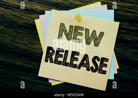 Conceptual hand writing text caption inspiration showing New Release . Business concept for Technology Software Update written on sticky note paper on Stock Photo