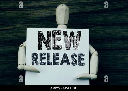 Conceptual hand writing text caption inspiration showing New Release . Business concept for Technology Software Update written on sticky note paper on Stock Photo