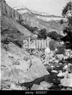 N Grand Canyon Historic- Phantom and Haunted Creeks Water  PHOTOGRAPHS TAKEN OF TRIP MADE TO HAUNTED AND PHANTOM CREEKS, OCTOBER, 1954, BY PARK ENGINEER CONN AND PARK RANGER DAVIS, IN CONNECTION WITH SURVEY OF AVAILABLE WATER IN THAT AREA.   CIRCA 1954. Stock Photo