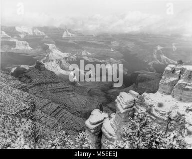 Grand Canyon Maer Point  VIEW FROM MATHER POINT DURING SNOWSTORM MARCH 4, 1956.  PLATEAU POINT APPPEARS IN CENTER PHOT; BRIGHT ANGEL CANYON LEADING OFF TOWARD NORTH. Stock Photo