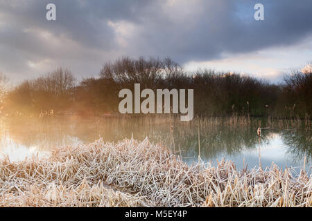 Barton-upon-Humber , UK. 23rd February 2018. UK Weather: Sunrise over a Lincolnshire Wildlife Trust Nature Reserve at Barton-upon-Humber, North Lincolnshire, UK. 23rd February 2018. Credit: LEE BEEL/Alamy Live News Stock Photo