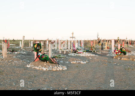 Lavrentiya, Chukotski region, Russia - Settlement Lavrentiya, June 16, 2017: Crosses, monuments and gravestones on a cemetery. Stock Photo