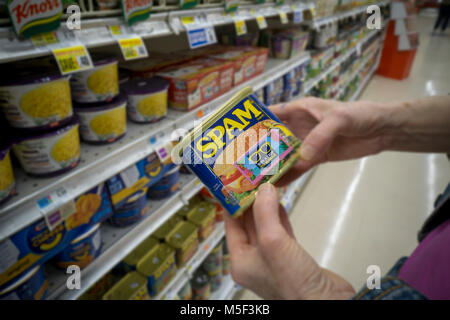 A shopper chooses a can of Spam by Hormel Foods in a supermarket in New York on Tuesday, February 20, 2018. Hormel Foods is scheduled to release its first-quarter results on Feb. 22 prior to the bell. (Â© Richard B. Levine) Stock Photo