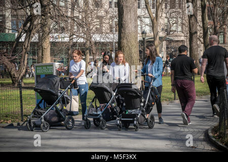 An armada of strollers in Madison Square Park in New York on Wednesday, February 21, 2018 with caregivers taking advantage of the unseasonably warm winter weather. Temperatures are expected to go into the upper 70's giving a preview of spring. (Â© Richard B. Levine) Stock Photo