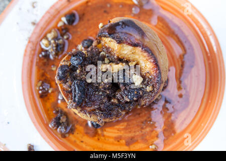 baked quince with nuts Stock Photo