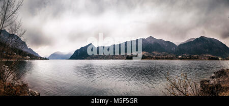 Panoramic view of a mountain lake in a winter valley. Famous little lake Idro in the center of the Alps Stock Photo