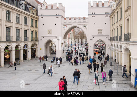 Street scene in old town city centre at 18th century Karlstor gate circa 1701 on Neuhauser Strasse, Karlsplatz, Munich, Bavaria, Germany, Europe Stock Photo