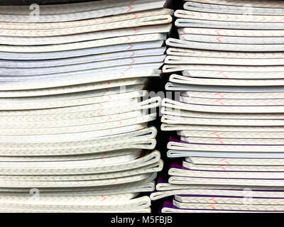 Pile of school notebooks on  shelf. Studio Photo Stock Photo