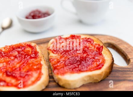 Jam on toast breakfast on white background Stock Photo