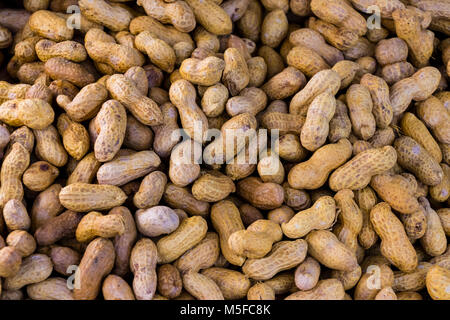 Over steam roasted peanuts on a market Stock Photo