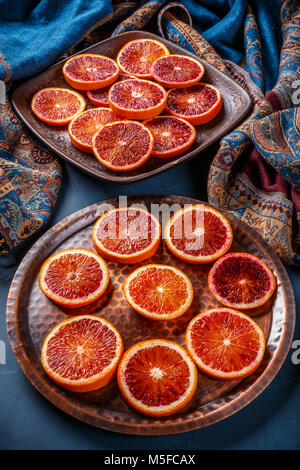 Sliced Ripe Juicy Sicilian Blood Oranges, Selective Focus. Long Harsh 