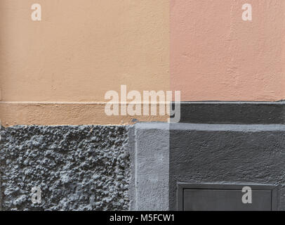 Detail of a house wall beige and gray areas Stock Photo