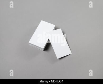 Blank business cards on grey paper background. Stock Photo