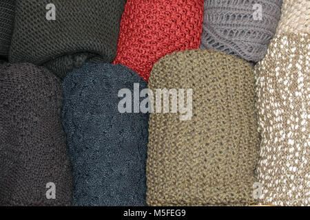 Open drawer with wool sweaters Stock Photo