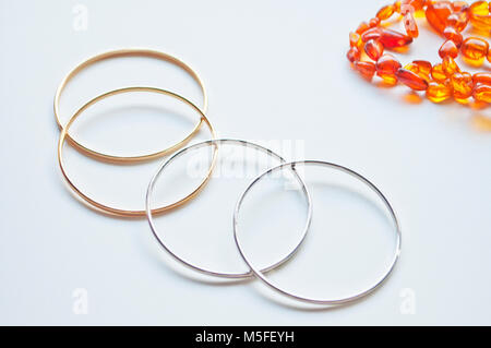 Gold ans silver bracelets isolated on a white background Stock Photo