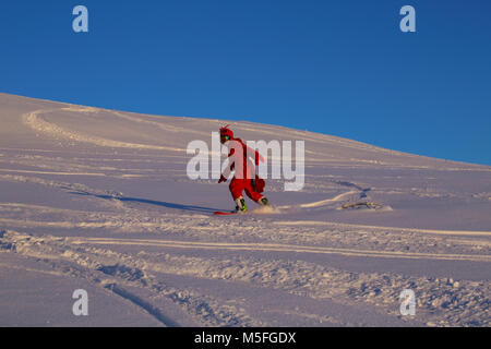 Snowboarder in funny shrimp kigurumi pajamas costume at ski slope Stock Photo