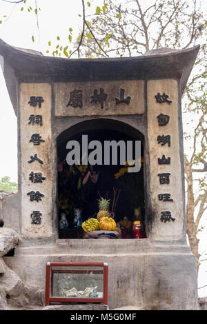 Offerings of fruit at Den Ngoc Son Confucious Temple at Ho Hoan Kiem lake, Hanoi, Vietnam Stock Photo