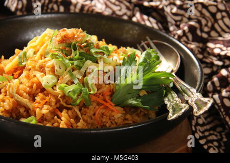 Nasi Goreng Jawa. Indonesian fried rice cooked in Javanese style with sweet soy sauce Stock Photo