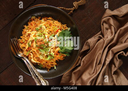 Nasi Goreng Jawa. Indonesian fried rice cooked in Javanese style with sweet soy sauce Stock Photo