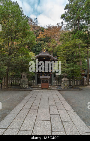 Shirahata Jinja (White Flag shrine). Black painted shinto sub shrine of the Hachiman-gu Shrine in Kamakura. dedicated to Minamoto Yoritomo and Minamot Stock Photo