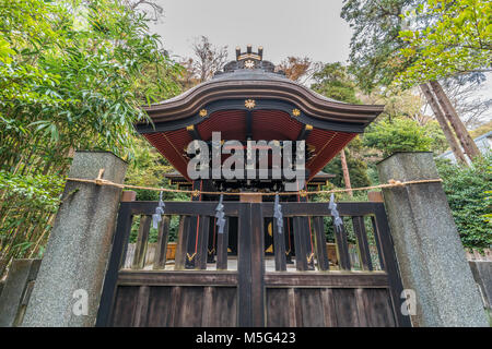 Shirahata Jinja (White Flag shrine). Black painted shinto sub shrine of the Hachiman-gu Shrine in Kamakura. dedicated to Minamoto Yoritomo and Minamot Stock Photo