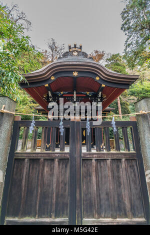 Shirahata Jinja (White Flag shrine). Black painted shinto sub shrine of the Hachiman-gu Shrine in Kamakura. dedicated to Minamoto Yoritomo and Minamot Stock Photo