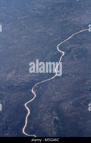 Aerial view of a dry river running inland taken from a plane, Coastline, Africa Stock Photo