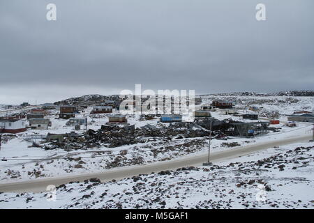 View of Cape Dorset (Kinngait) Nunavut with a view of the ocean and ...