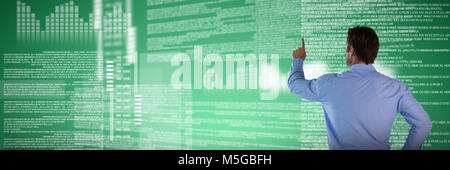 Composite image of rear view of businessman with hand on hip touching invisible interface Stock Photo
